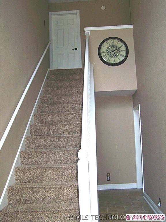 Large entry leads to living room as well as the up