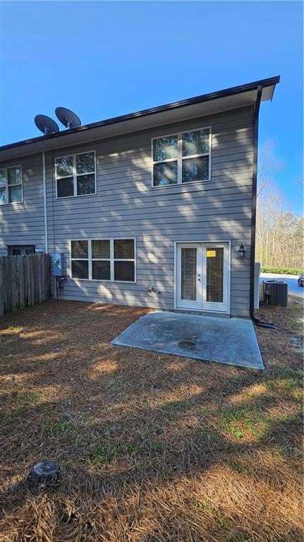 Back of property with fence, central AC, a lawn, f