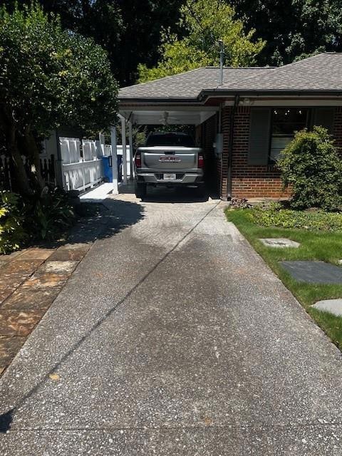View of property exterior featuring a carport