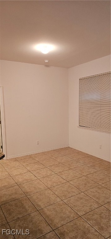 Spare room featuring tile patterned flooring