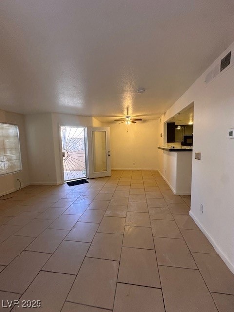 Spare room with light tile patterned floors, ceili