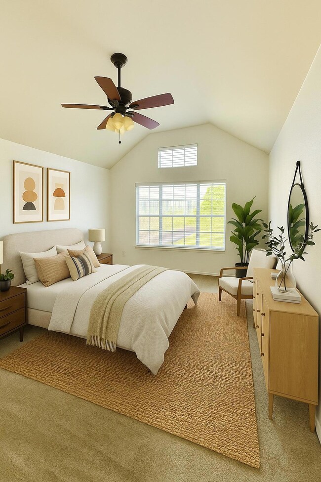 Bedroom featuring light colored carpet, vaulted c