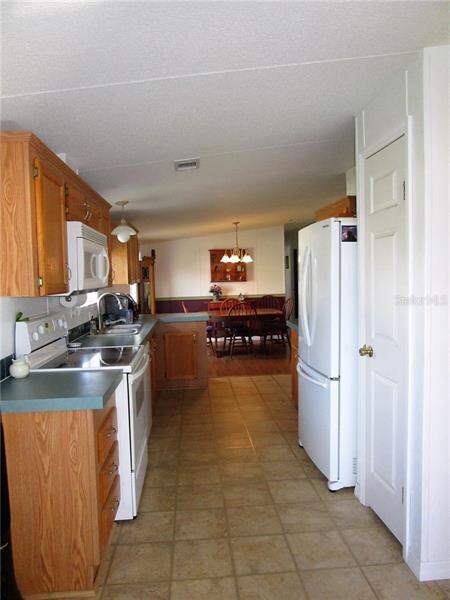 Another view of kitchen and dining area.  Kitchen 