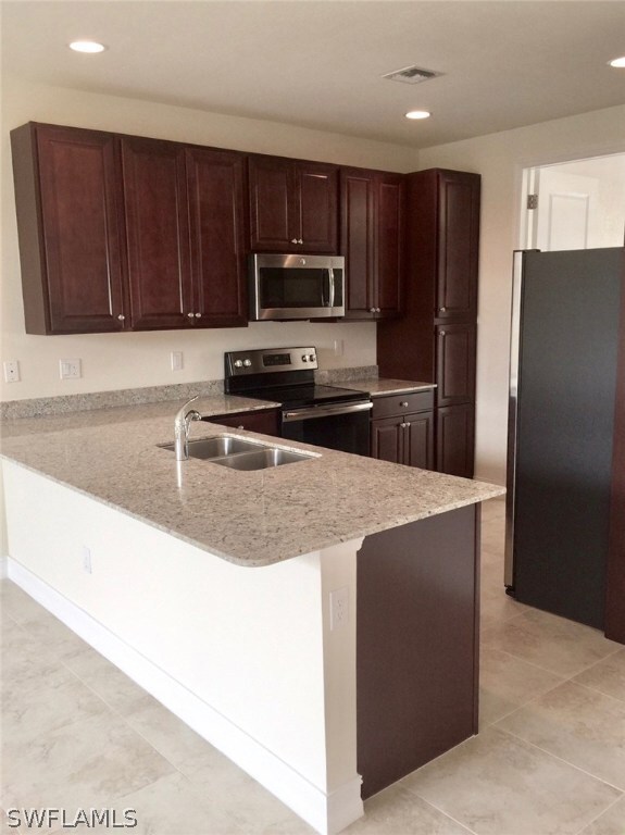 Lots of Granite Countertop space in this Kitchen