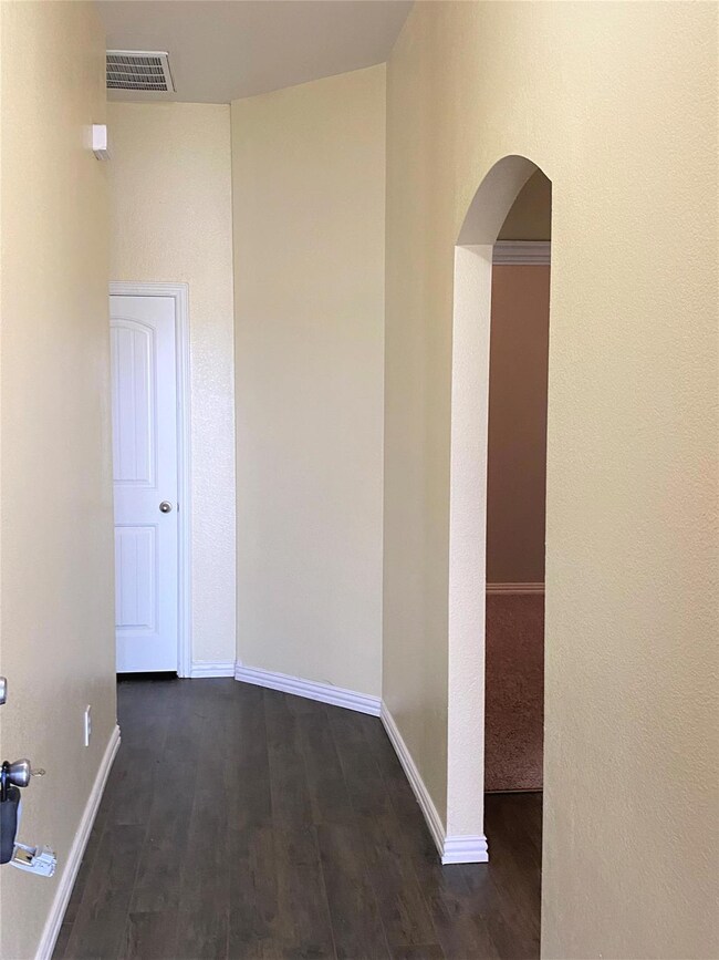 Hallway featuring wood-type flooring