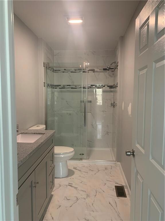 Master Bathroom with double vanity and walk-in sho
