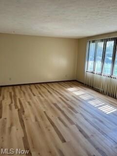 Featuing a textured ceiling and light 30 year wate