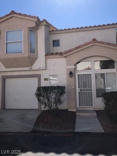 View of front of property featuring an attached ga