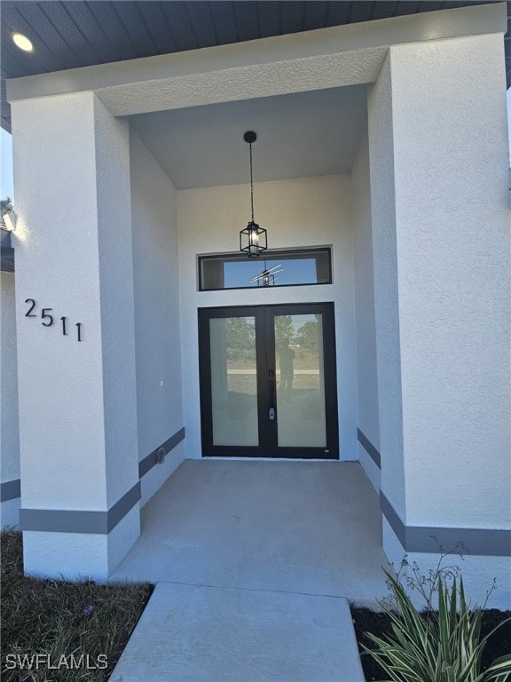 Entrance to property featuring french doors