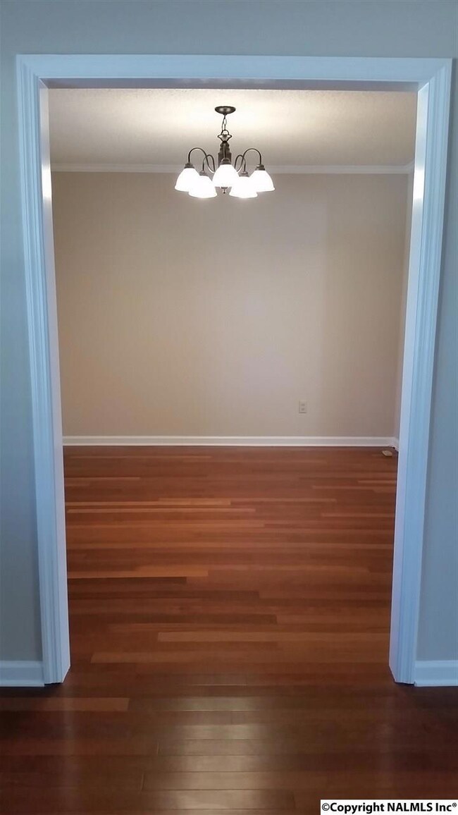 Beautiful dining room with fresh paint and beautiful floors!