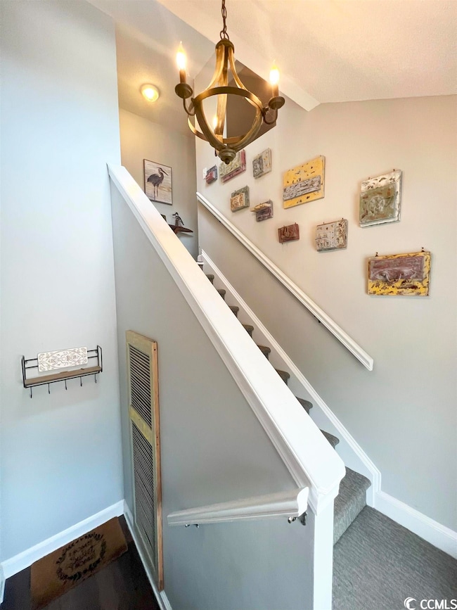 Entrance foyer with vaulted ceilings and tons of n