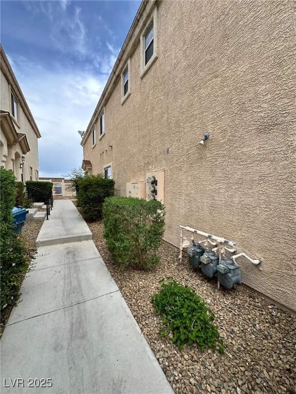 View of property exterior featuring stucco siding