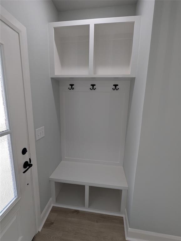 Mudroom with wood-type flooring