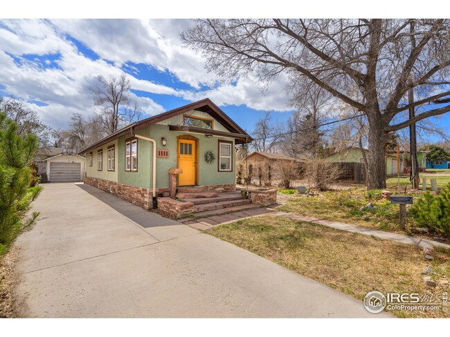 Long private driveway leading to a one car garage in back.