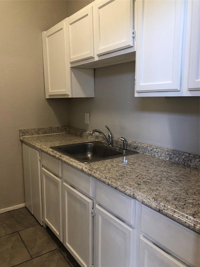 This view of the kitchen shows the vast counter sp