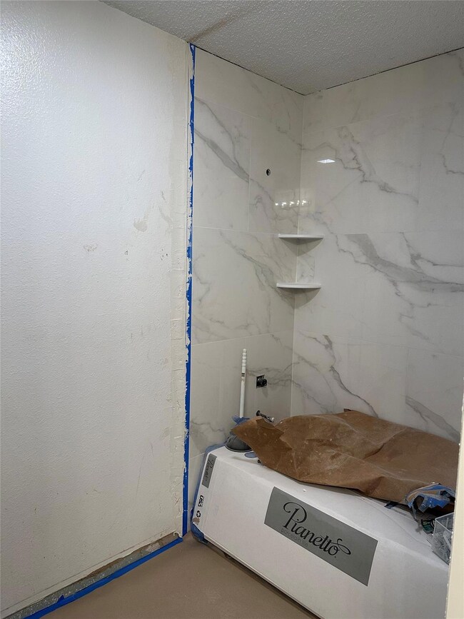 Bathroom with a textured ceiling