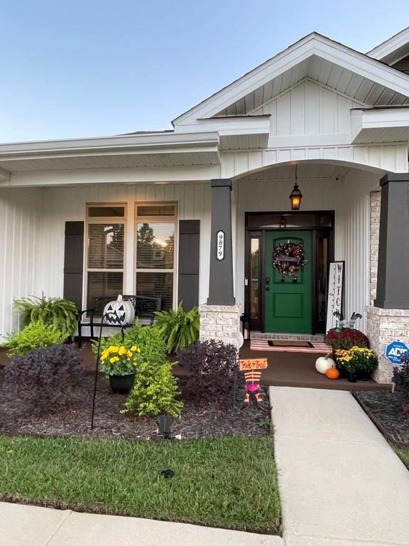 Doorway to property featuring stone siding