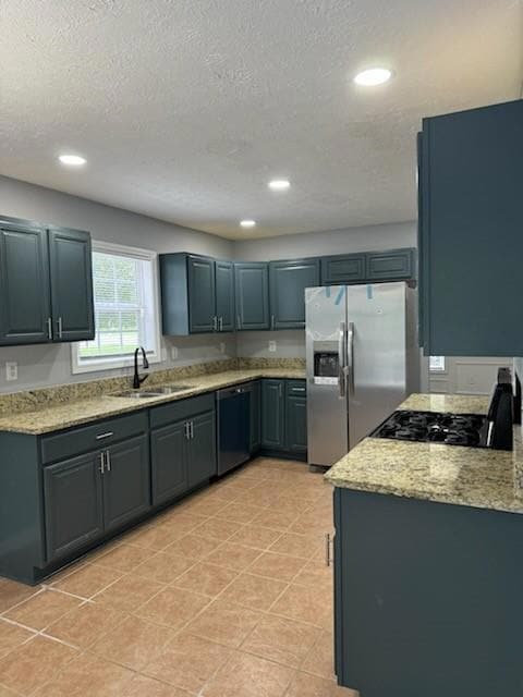 Kitchen with a sink, stainless steel fridge with i