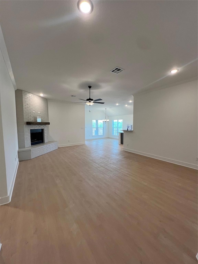 Unfurnished living room with light wood-type floor