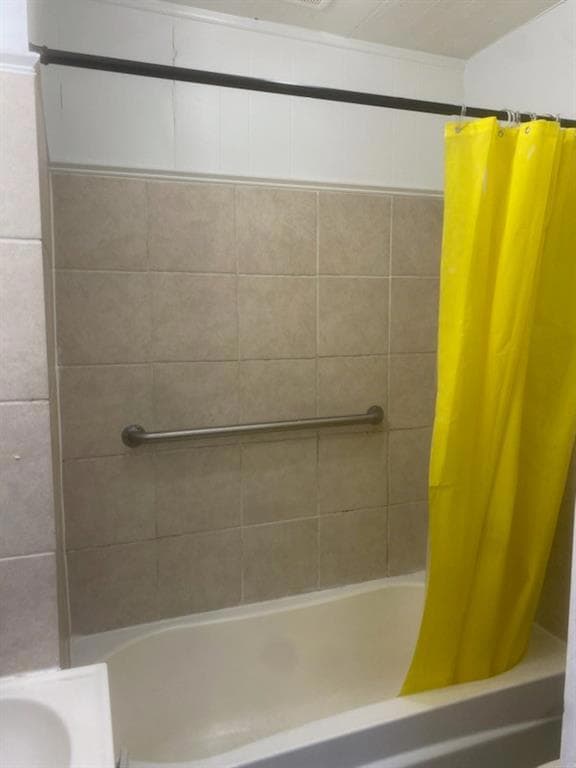 Full bathroom with shower / tub combo