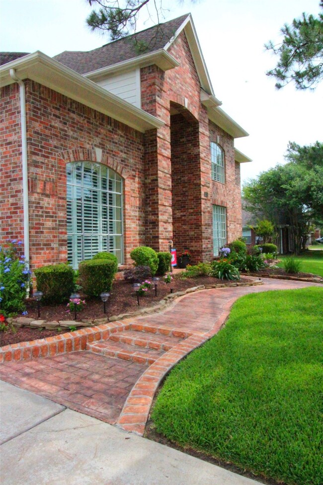 Follow the brick pathway to this amazing 4-BR home.