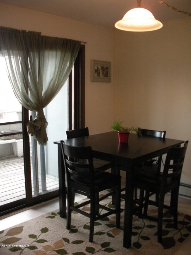 Dining Area w Glass Door to Private Deck