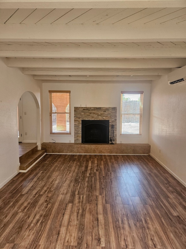 Living Room with fireplace and wood floors