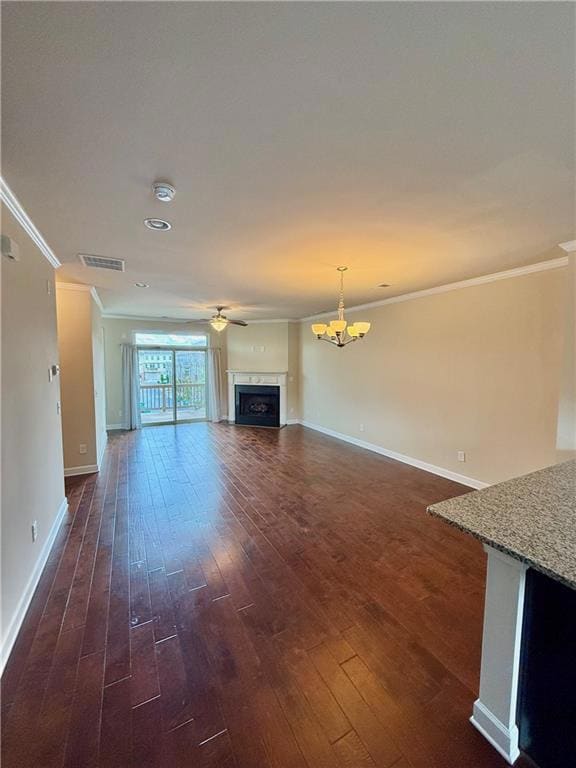 Unfurnished living room featuring baseboards, orna
