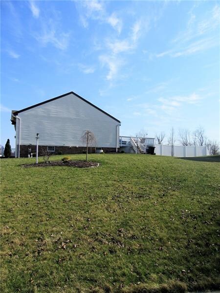 LARGE corner lot with attractive landscaping!