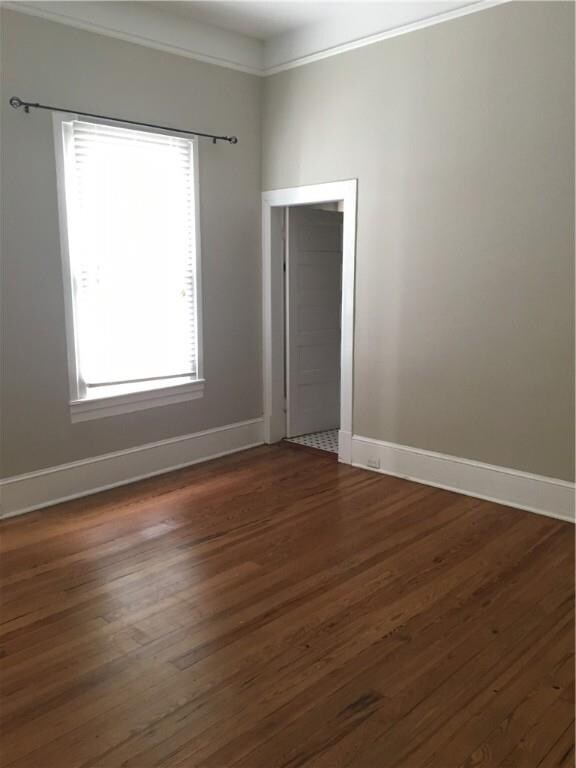 Master bedroom and doorway to full bathroom.