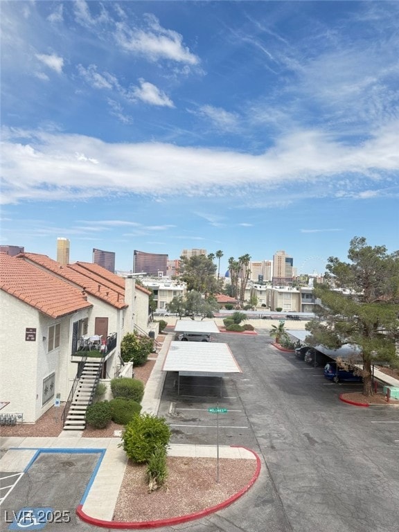 View of asphalt street with stairs and curbs