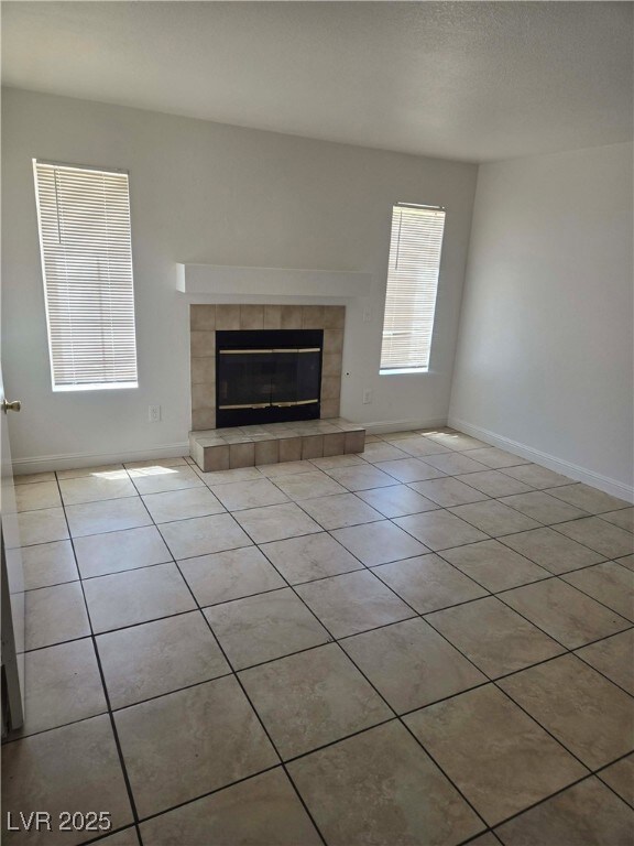 Unfurnished living room with tile patterned floors
