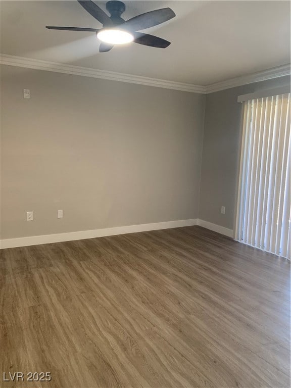 Empty room with crown molding, ceiling fan, and wo
