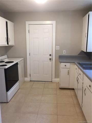 Kitchen with fresh paint & beautiful tile floors!