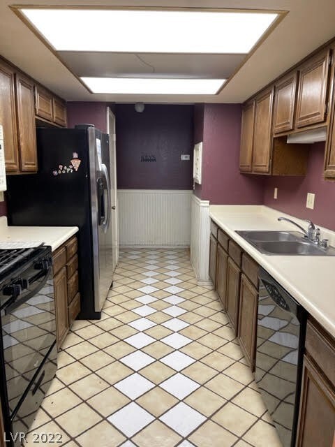 Kitchen looking to hall that leads to garage entry