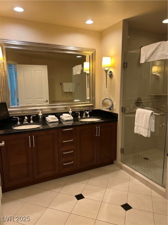 Full bathroom featuring double vanity, a shower st