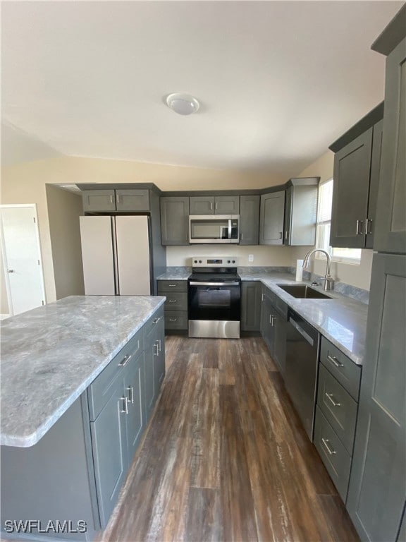 Kitchen with stainless steel appliances, a sink, d