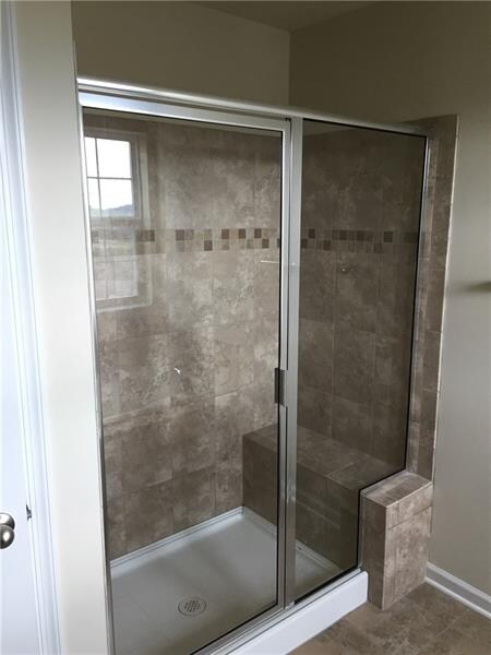 ceramic master bath shower stall with bench