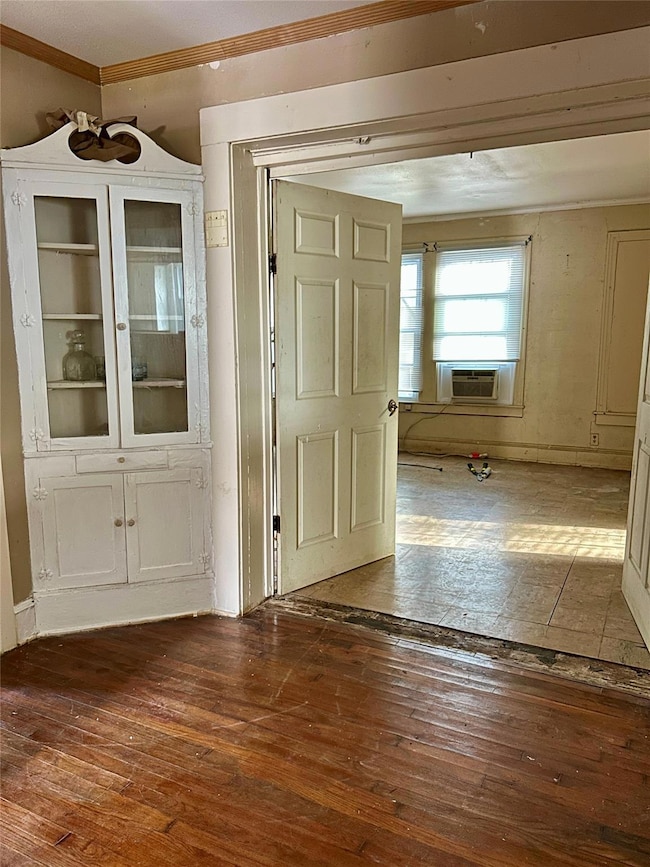 Entrance foyer featuring hardwood / wood-style flo