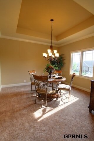 This dining room can easily be converted into a third bedroom on the main or a den with French doors.