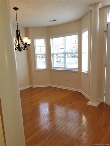 Dining area with a bay window for plenty of light.