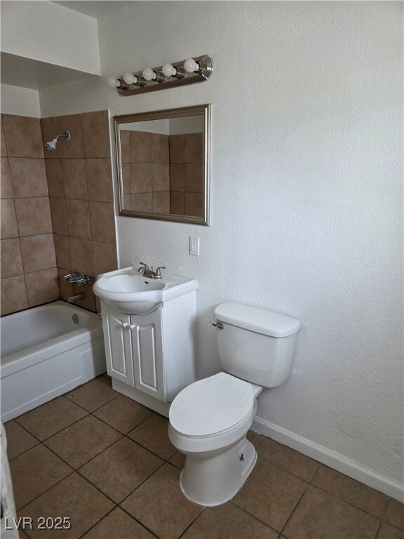 Full bathroom featuring vanity, tile patterned flo