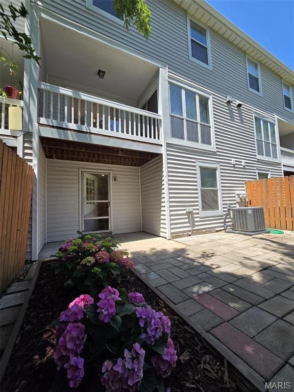 Rear view of property featuring a patio area
