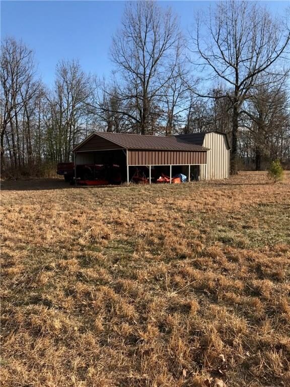 20x22 carport added to front of 10x16 barn