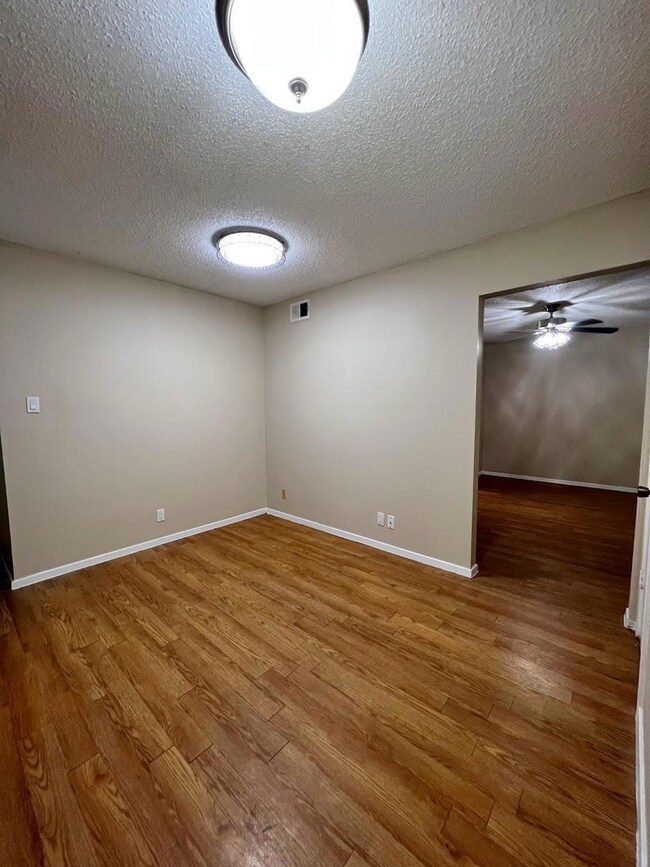 Unfurnished room featuring a textured ceiling, vi