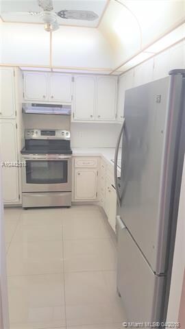 Tiled kitchen with new appliances