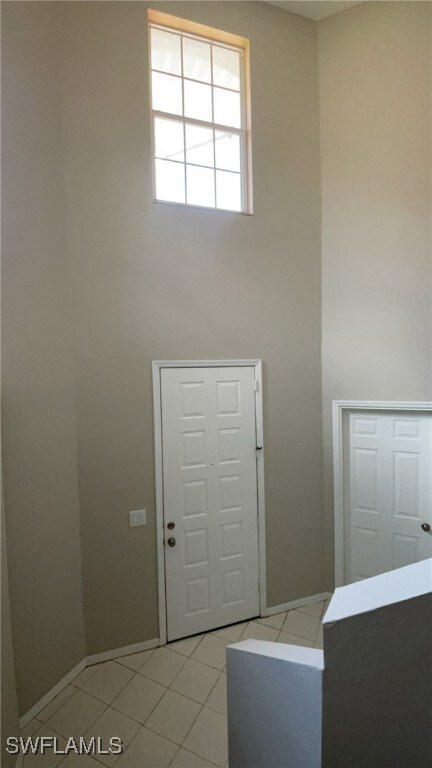 Entrance foyer featuring light tile patterned floo