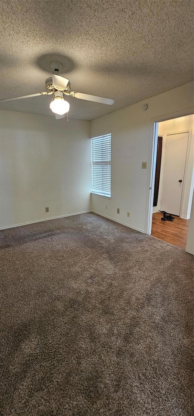Carpeted downstairs  bedroom with full private bat
