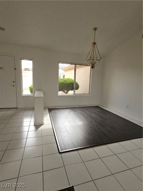 Formal dining area featuring wood-like floors, a c