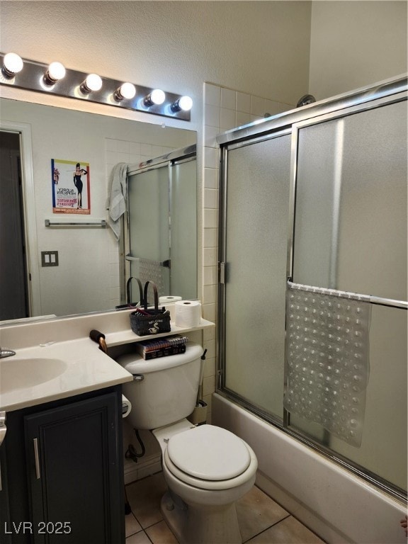 Full bath with tile patterned floors, vanity, and